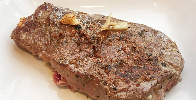 Finished steak with frying pan