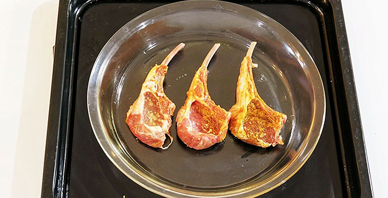 Lamb meat cooking in oven