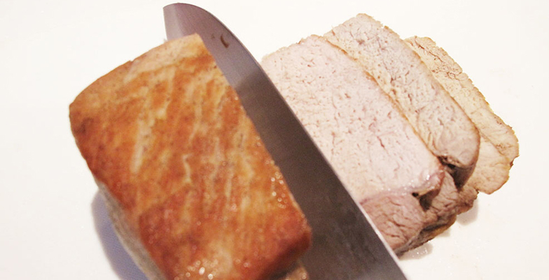 Cutting the roast pork